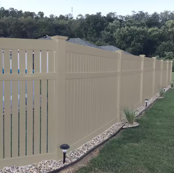 Tan Barrington semi-privacy vinyl fence with solar lights along landscaped yard